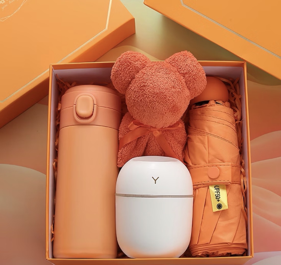 Orange gift box with flask, towel bear, humidifier and umbrella